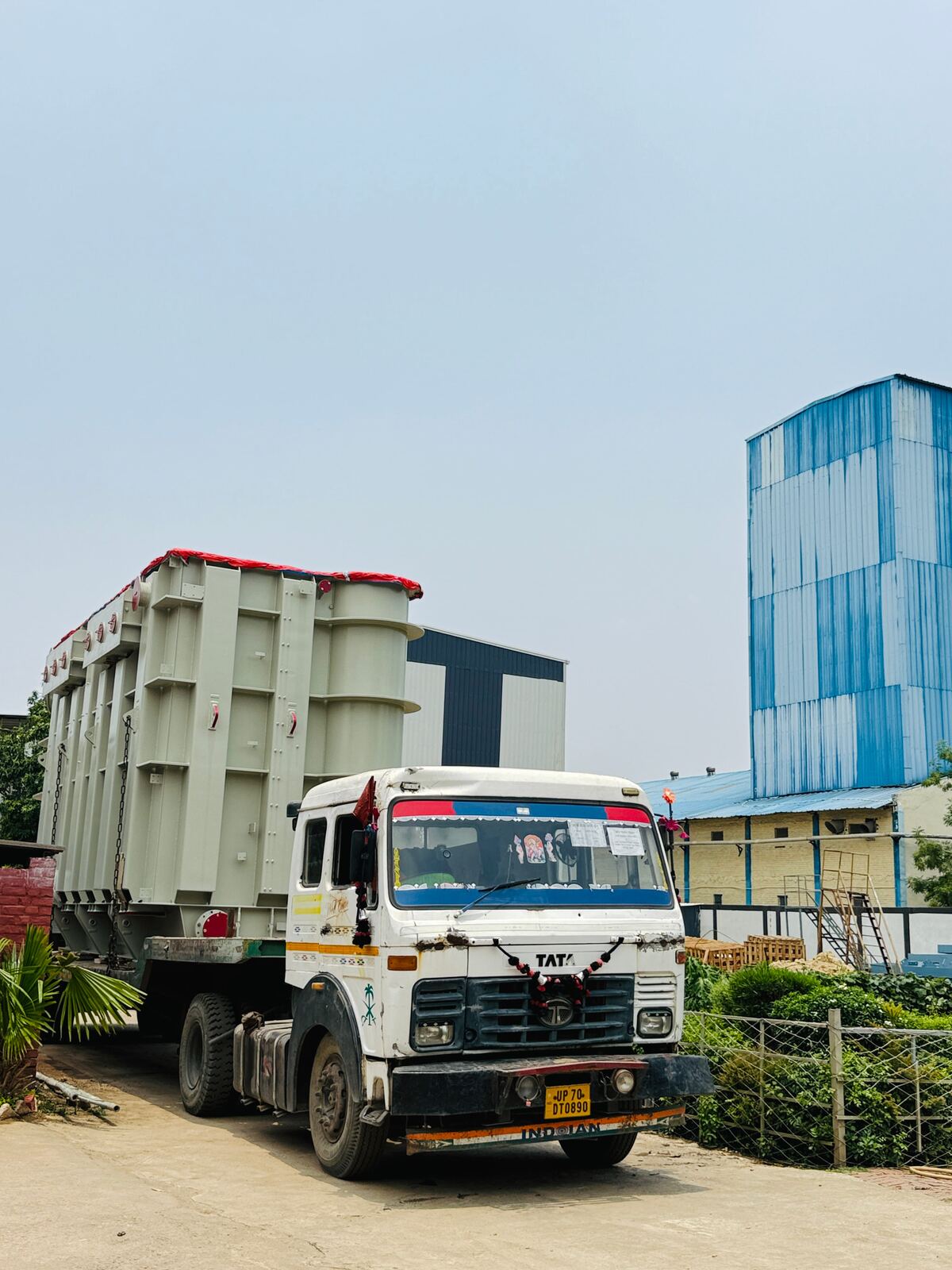 Fabricated steel tank loaded on a truck outside the workshop